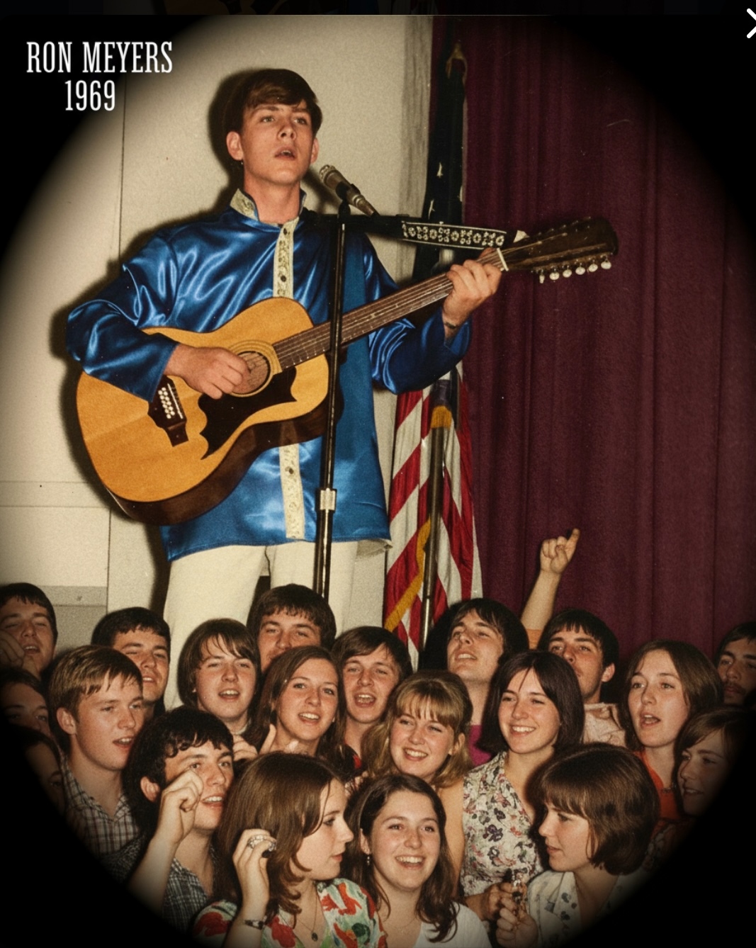 Ron Meyers performing on stage in 1969, crowd of young fans in front of him