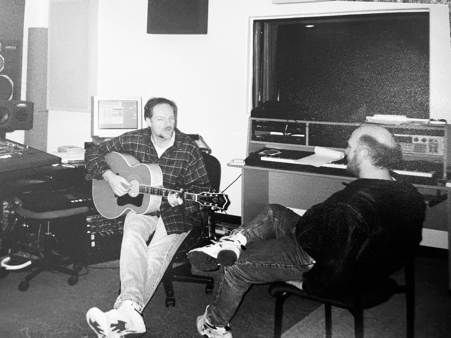 Ron Meyers with Clay Smith in the recording studio, acoustic guitar in hand
